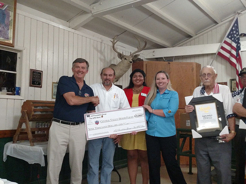 Left to Right : Representative of the Central Valley Honor Flight tour Allan Perry, Rodney Torres, Representing Senator Ant